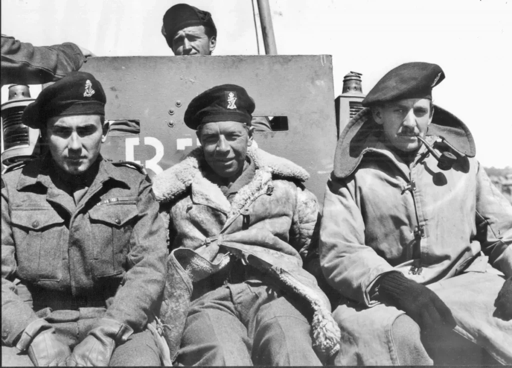 2Lt McCord (seated right) tendering to board HMS Belfast