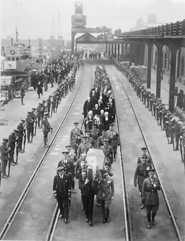 A Guard of Honour provided by the 2nd Battalion The Royal Irish Fusiliers lines the route of The Unknown Warrior's journey from HMS Verdun at Dover's Western Docks.