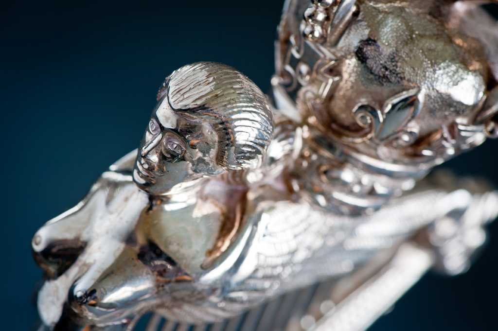 Detail of a silver Royal Irish Regiment cap badge sculpture