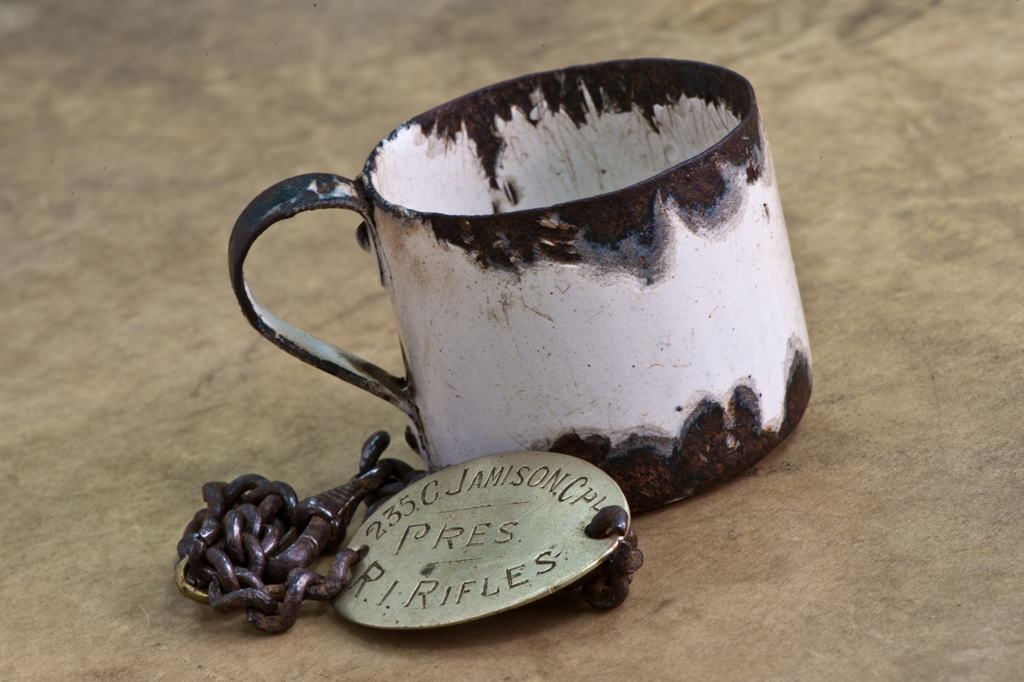 A miniature tin cup for measuring a tot of rum